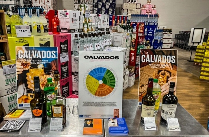 Educational materials displayed on a table along with alcoholic products.